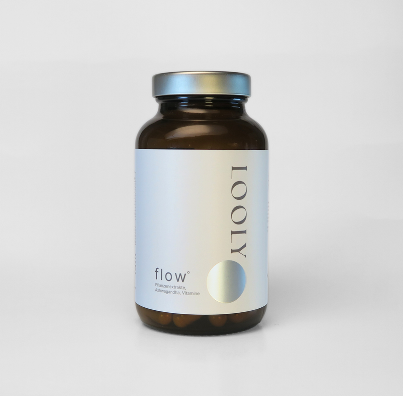 LOOLY balance Nahrungsergänzungsmittel in brauner Glasflasche mit Kapseln und minimalistischem Etikett vor hellem Hintergrund

